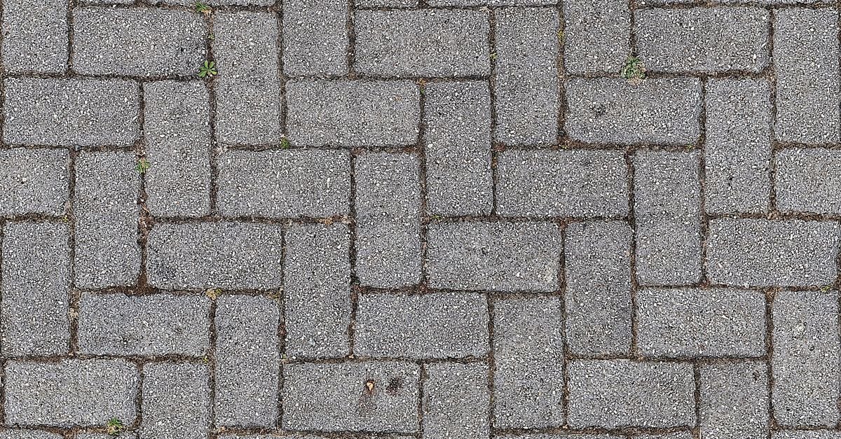 Pavimento de blocos intertravados de concreto cinza visto de cima